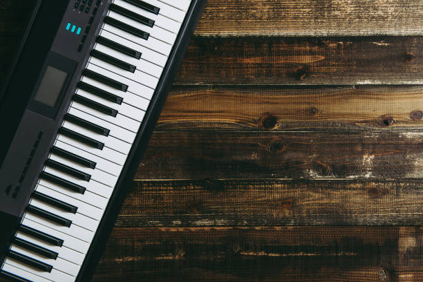 istock Electronic piano on the wood table 937651136