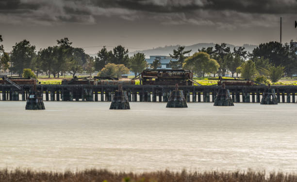 istock Mare Island Ca. pier and abandon buildings on a cloudy day 937655986
