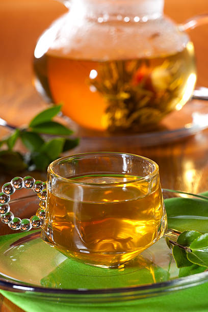 istock Glass of greean tea and teapot 93766599