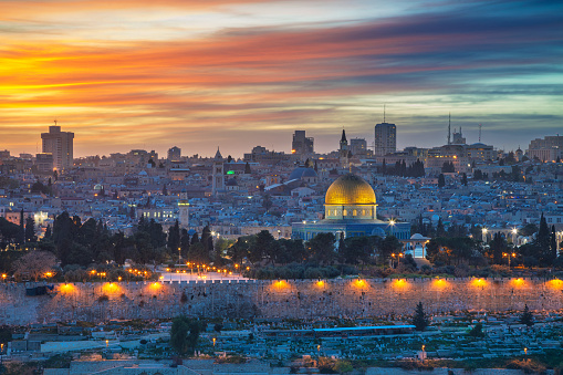 Cityscape image of Jerusalem, Israel with Dome of the Rock at sunset.