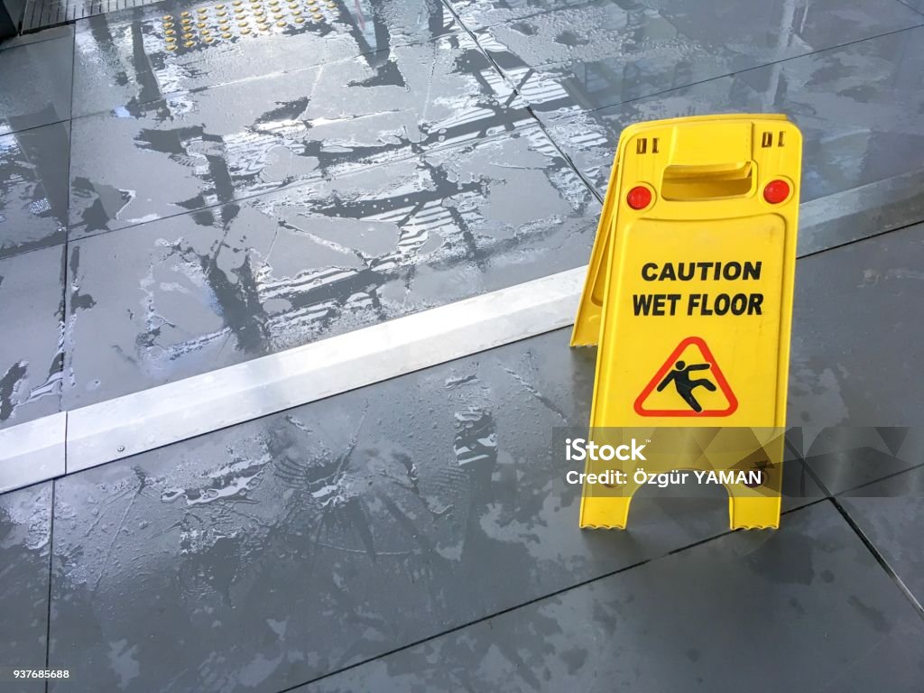 Wet floor sign Wet floor sign in airport Flooring Stock Photo