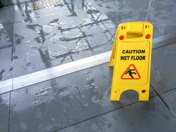 Wet floor sign Wet floor sign in airport wet stock pictures, royalty-free photos & images