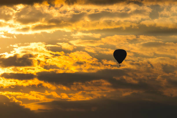 istock Hot air balloon on sky at sunset 937689100