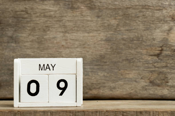 istock White block calendar present date 9 and month May on wood background 937689812