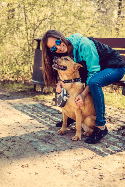 istock Casual brunette female with her brown dog. 937710552