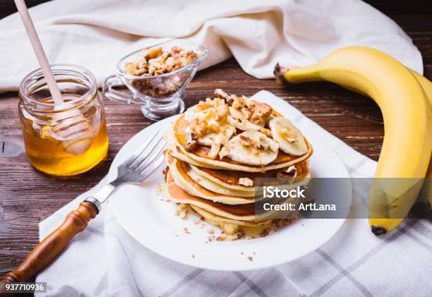 Pancakes With Banana Walnuts And Honey Stock Photo - Download Image Now - Pancake, Banana, Breakfast