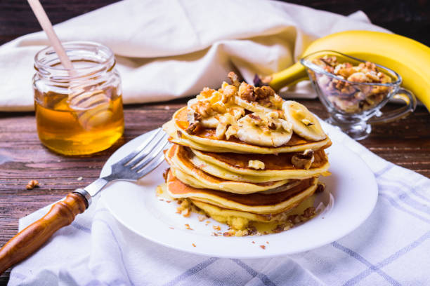 istock Pancakes with banana, walnuts and honey 937710940