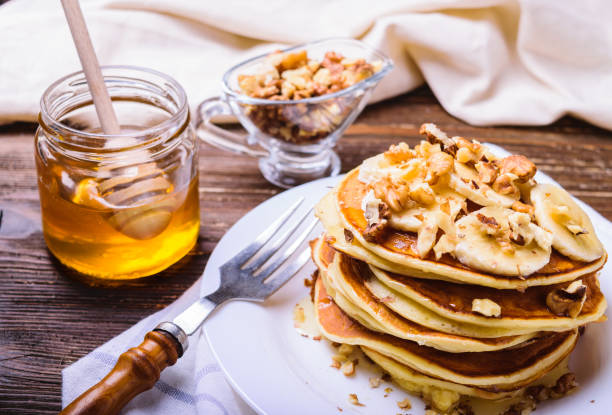istock Pancakes with banana, walnuts and honey 937710942