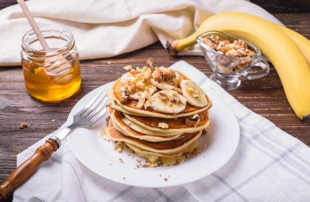 istock Pancakes with banana, walnuts and honey 937710948