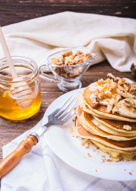 istock Pancakes with banana, walnuts and honey 937710952