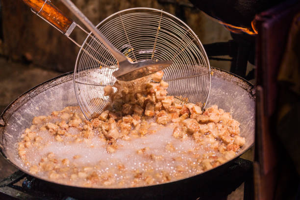 istock Fry the pork skin in a large saucepan. 937712634