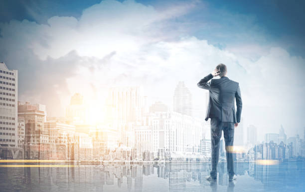 istock Rear view businessman scratching head, cityscape 937716806