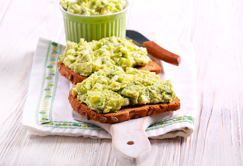 Avocado and egg salad over brown bread