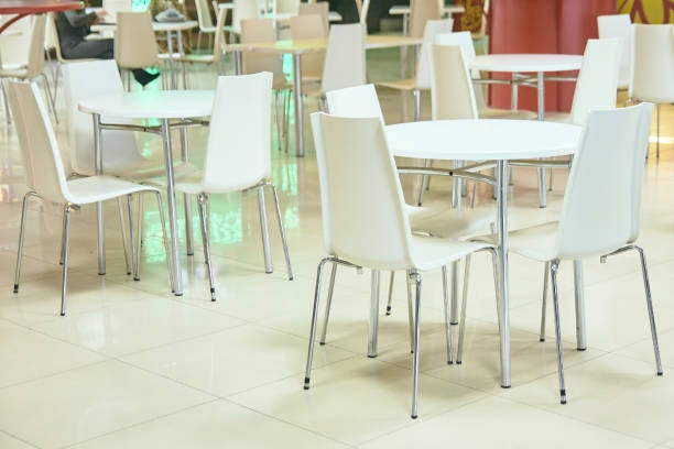 istock Food court. White tables and chairs. Bright interior 937727810
