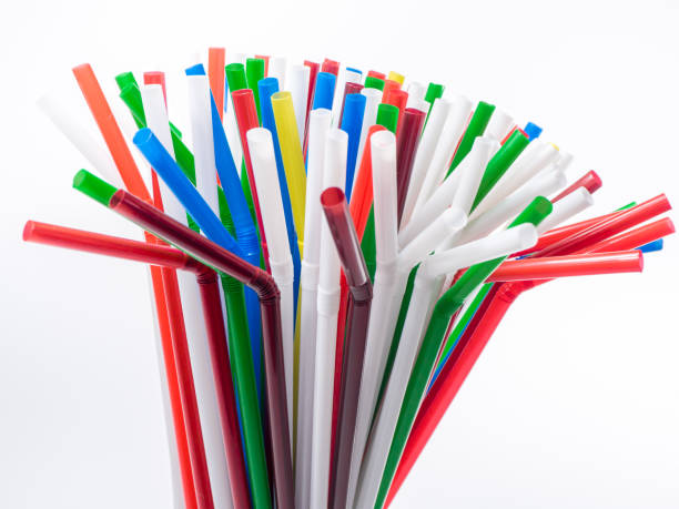 istock Colorful plastic drinking straws over white background. Carrying a summer mood. 937731456