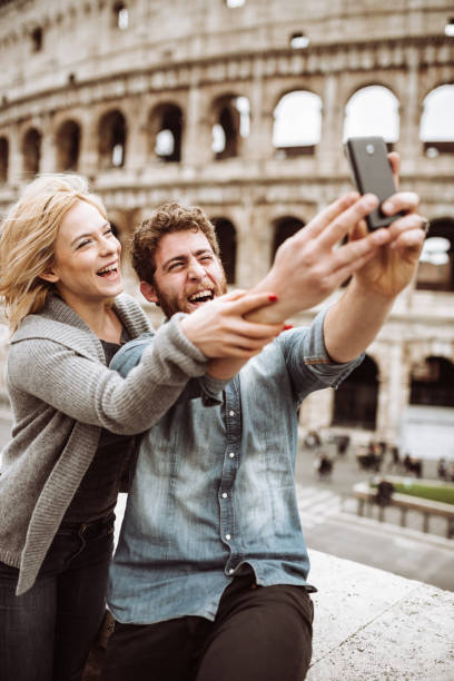 istock tourist in Rome take a selfie at coliseum 937731616