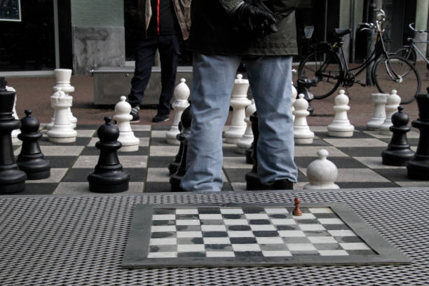 istock A small chess board next to a giant chess board 937732372