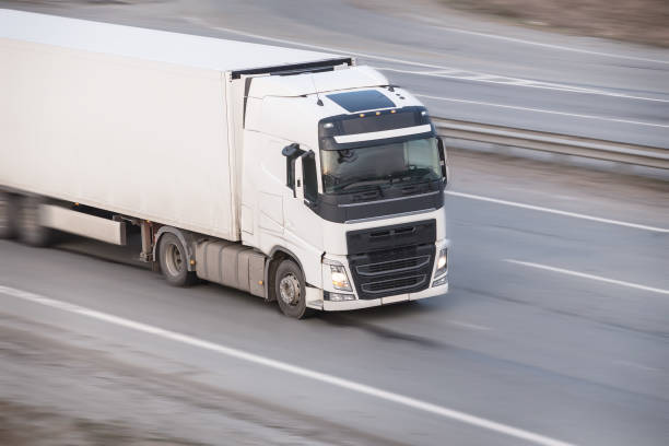 istock truck moves on highway 937736094