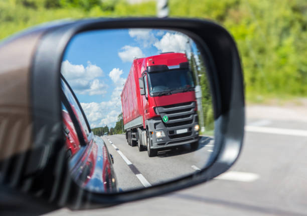 istock truck reflection in a car mirror 937736394