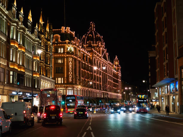 View of the Harrods Department Store on Brompton Road in Knightsbridge, London at night. LONDON, UK - SEPTEMBER 14, 2017: View of the Harrods Department Store on Brompton Road in Knightsbridge, London at night. harrods photos stock pictures, royalty-free photos & images