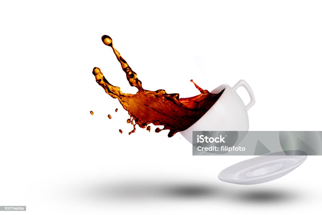 Coffee spilling out of a coffee cup on white background Spilling Stock Photo