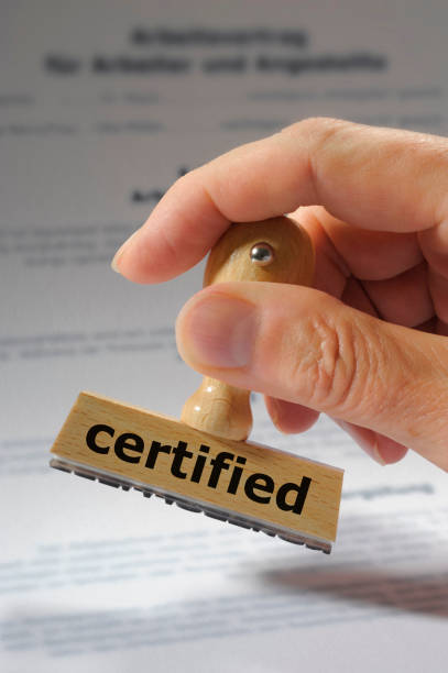 istock certified printed on rubber stamp in hand 937746616