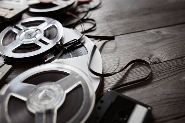 istock Old audio reels and cassette tape background 937749804
