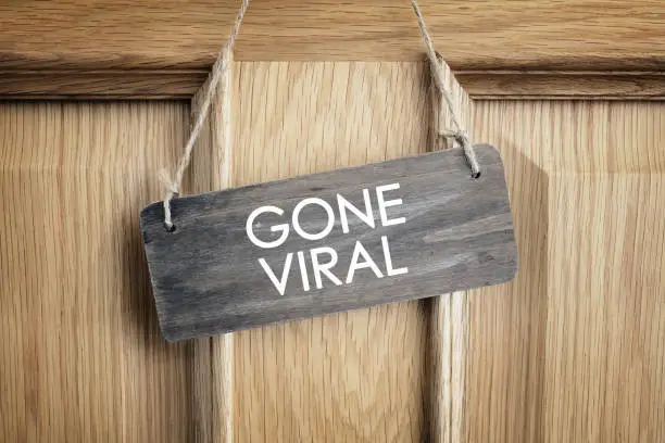 Photo of Gone viral sign on office door concept for internet marketing and social media