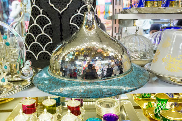 Shiny lamp shade in the storefront with other household items in an indoor market in Istanbul, Turkey