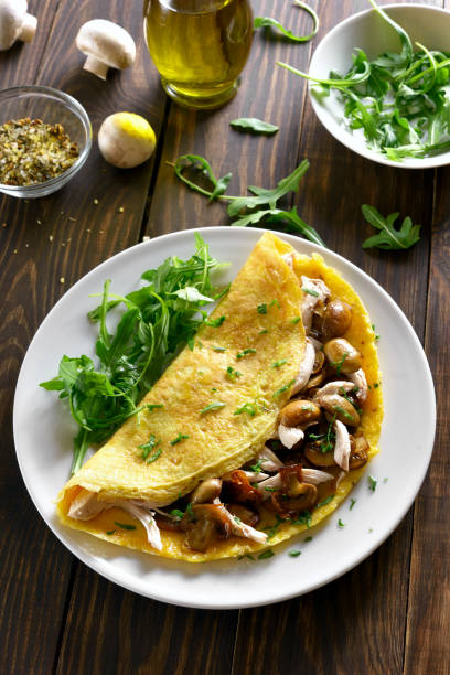 istock Omelette with mushrooms, chicken meat, greens 937753180