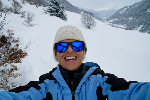 istock Woman takes selfie on snowy slope 937754210