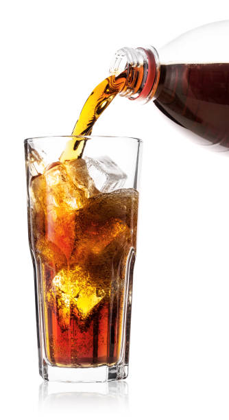 istock Cola poured into glass with ice 937756558