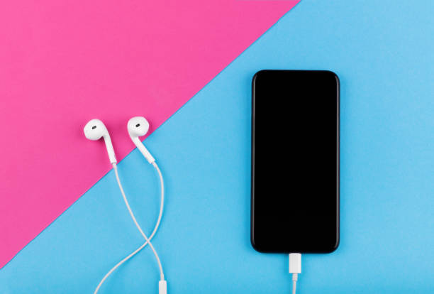 istock phone on a pink and blue background. clipping path inside 937757758