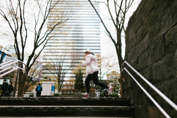 istock Woman running in city 937761308