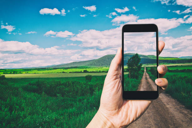 istock Taking a photo of Road In Grassland 937761418