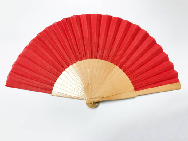 Red bamboo fan on white background Red bamboo fan on white background hand fan photos stock pictures, royalty-free photos & images