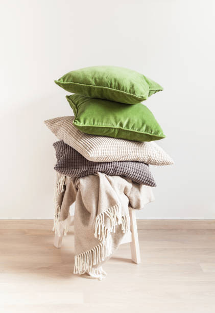 istock gray and green cushions, throw. cozy home 937769452