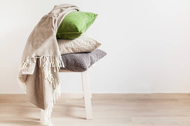 istock gray and green cushions, throw. cozy home 937774010