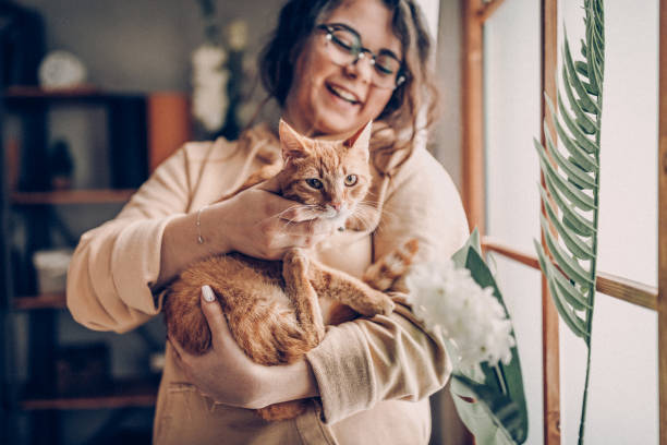 istock Carefree woman with cat 937777966