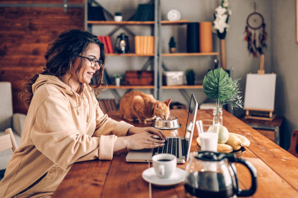 istock Enjoying working with my cat from home 937778374
