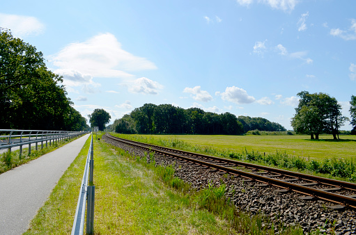 Bicycle lane between highway and railway track on the Baltic Sea Island Usedom, Germany