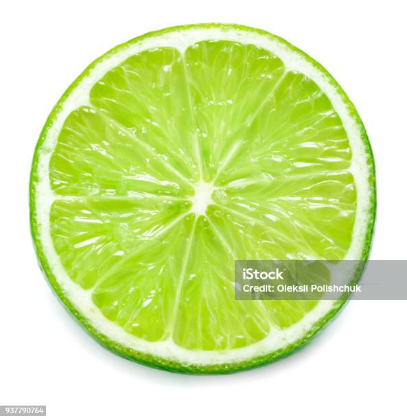 Single Slice Of Lime Isolated On White Background Stock Photo - Download Image Now - Lime, Slice of Food, Half Full