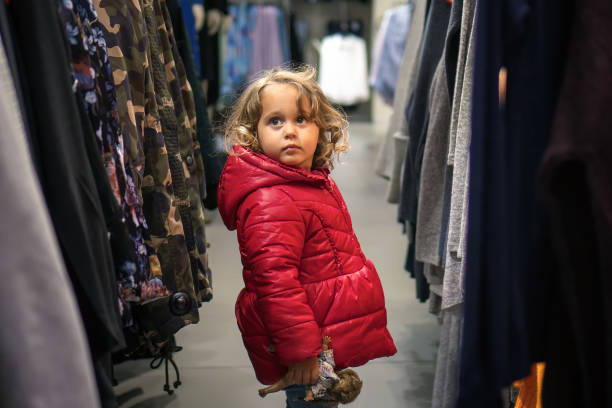 istock Little Girl Looking  in the Store 937795432