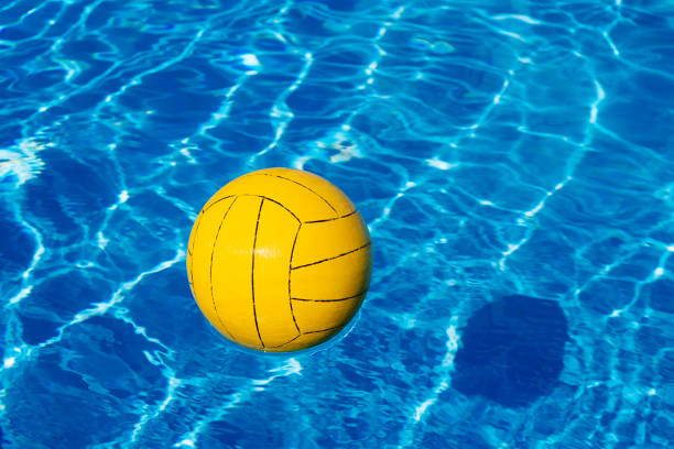 istock Yellow ball in the pool 937796240