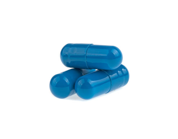 istock three blue capsule medicine isolated on white background 937797212