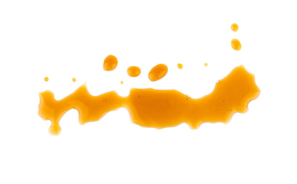 istock drops of caramel spray isolated on white background 937797328