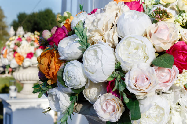 istock Decorations wedding bouquets of artificial flowers roses and white eustomas. 937799814