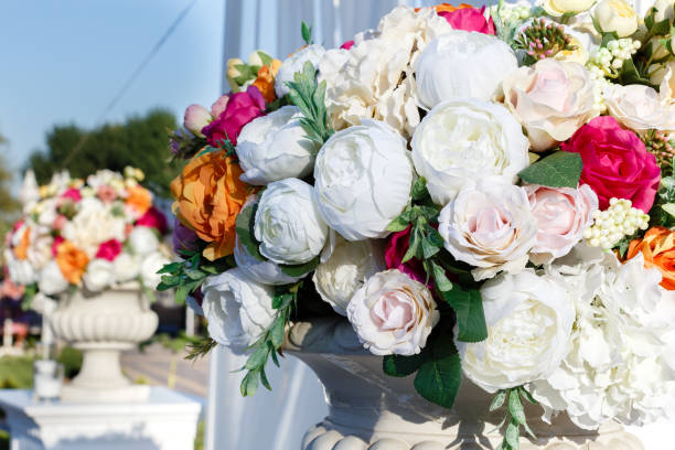 istock Decorations wedding bouquets of artificial flowers roses and white eustomas 937799836