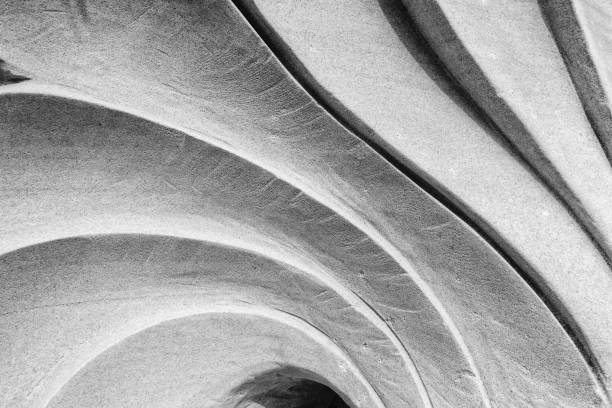 istock curve sculpture, striped of stone 937803416