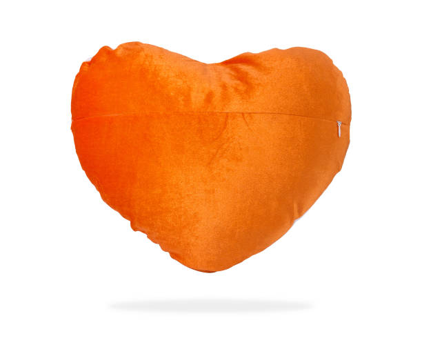 istock Orange heart pillow for hug or nap on isolated background with clipping path. 937808528